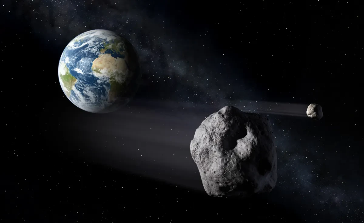 An asteroid in space, passing Earth.