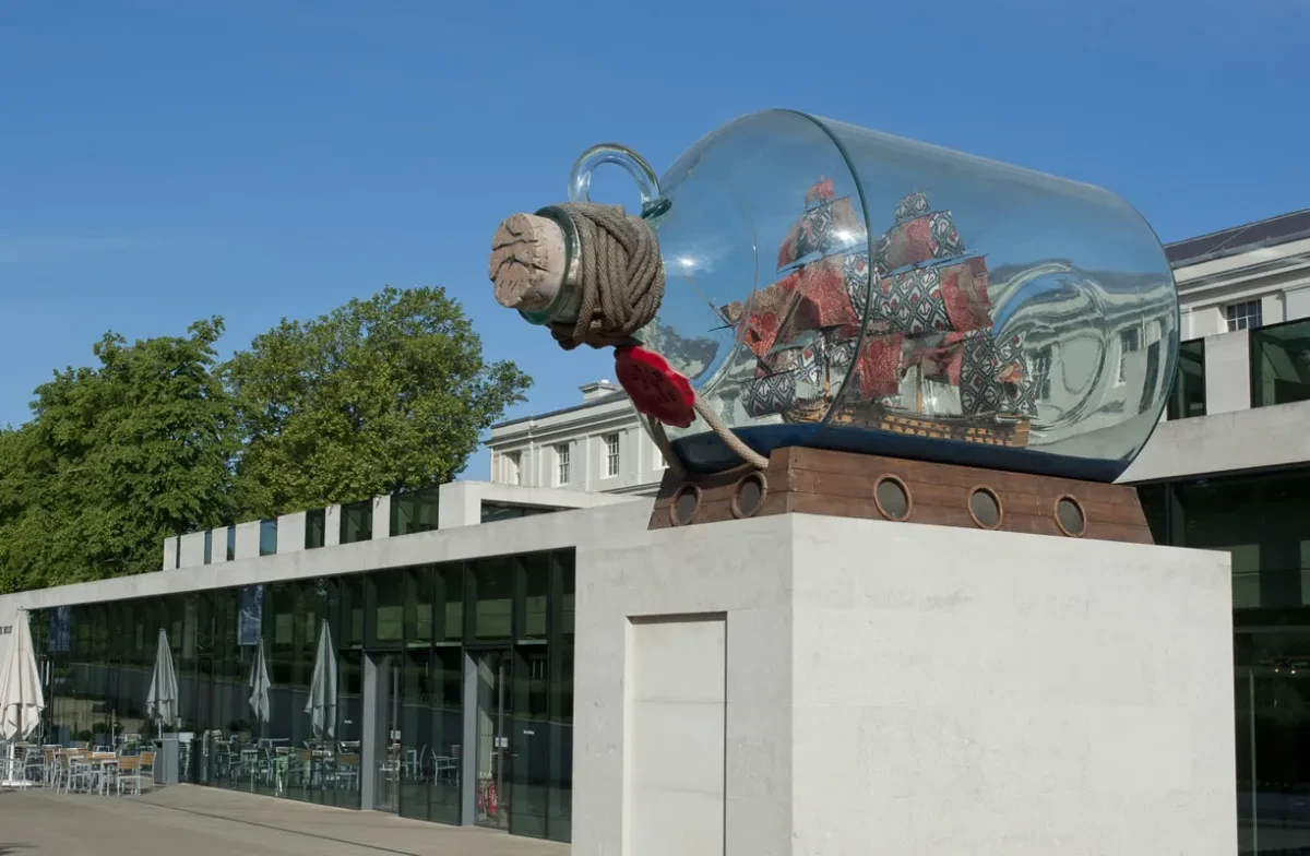 A model ship in a glass bottle in front of the National Maritime Museum.