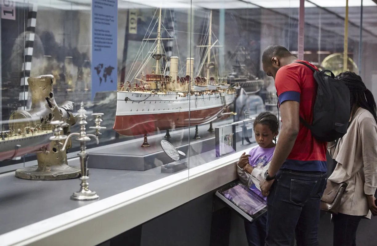 A family looks at exhibits in the Forgotten fighters gallery.