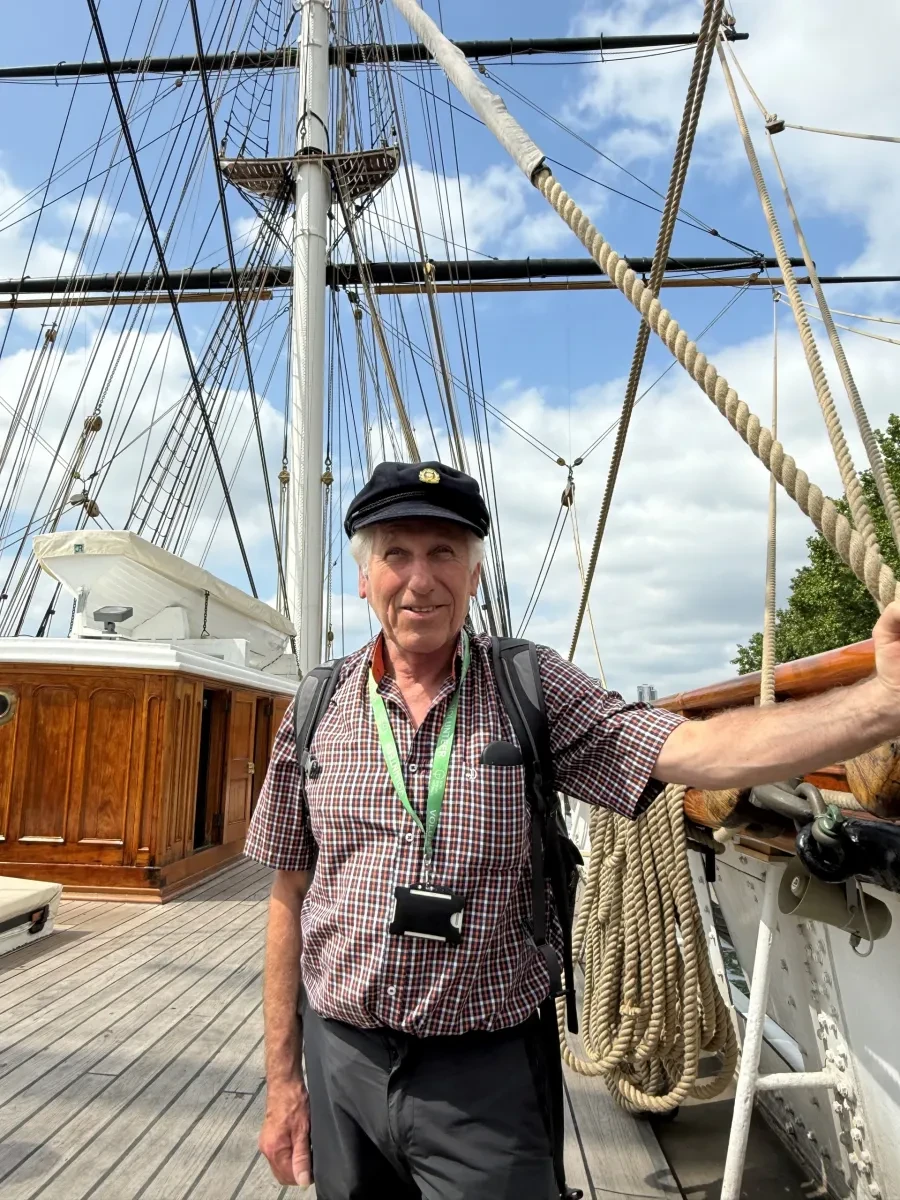 Photo of Patrick Smart smiling on board main deck of Cutty Sark